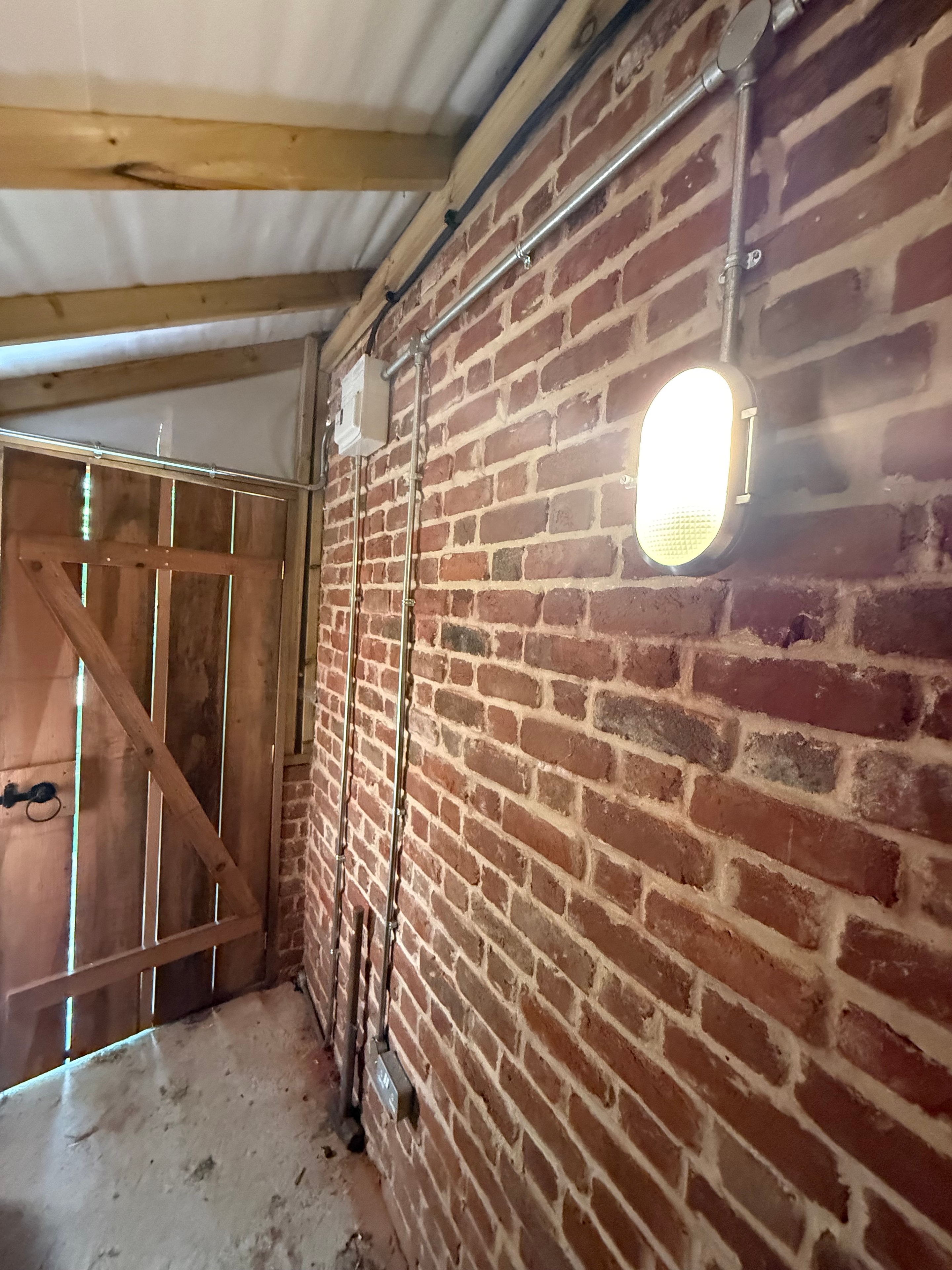 Exposed brick ceiling electrical installation