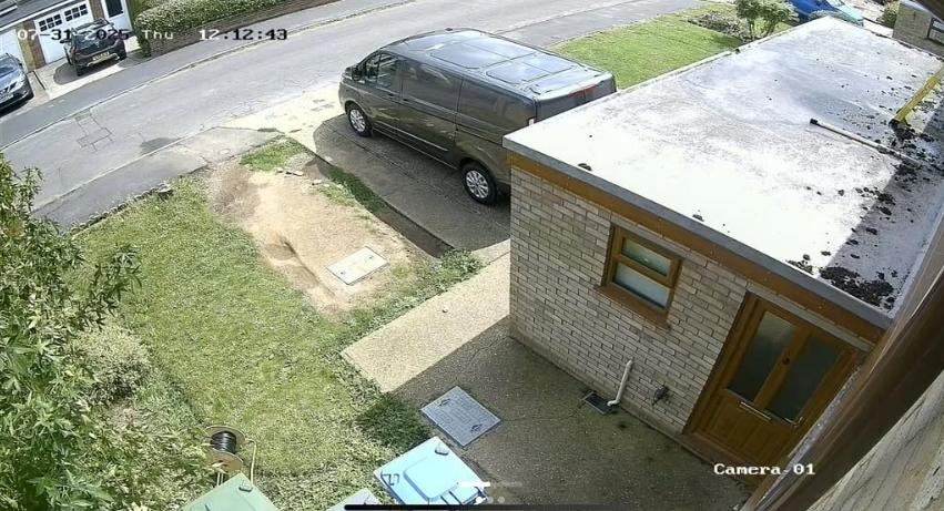 CCTV camera view of residential driveway