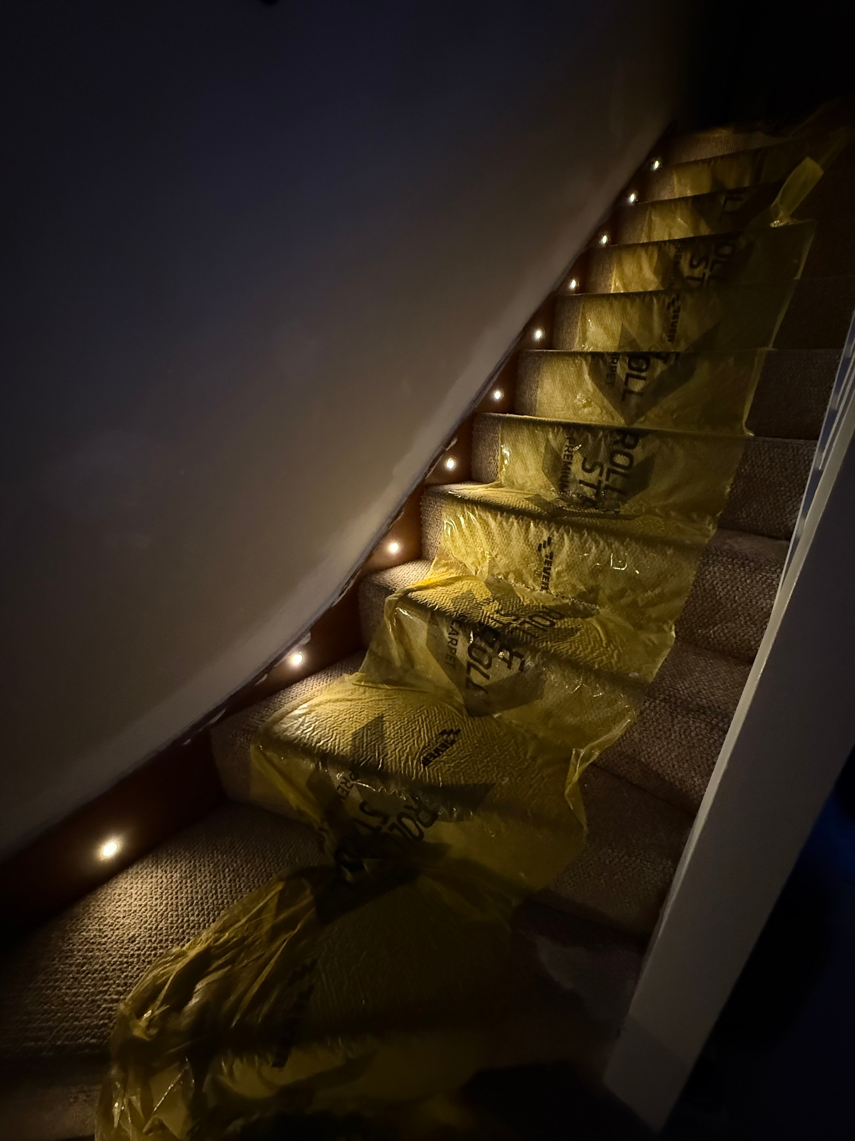 Stair riser LED lights installed with carpet protection