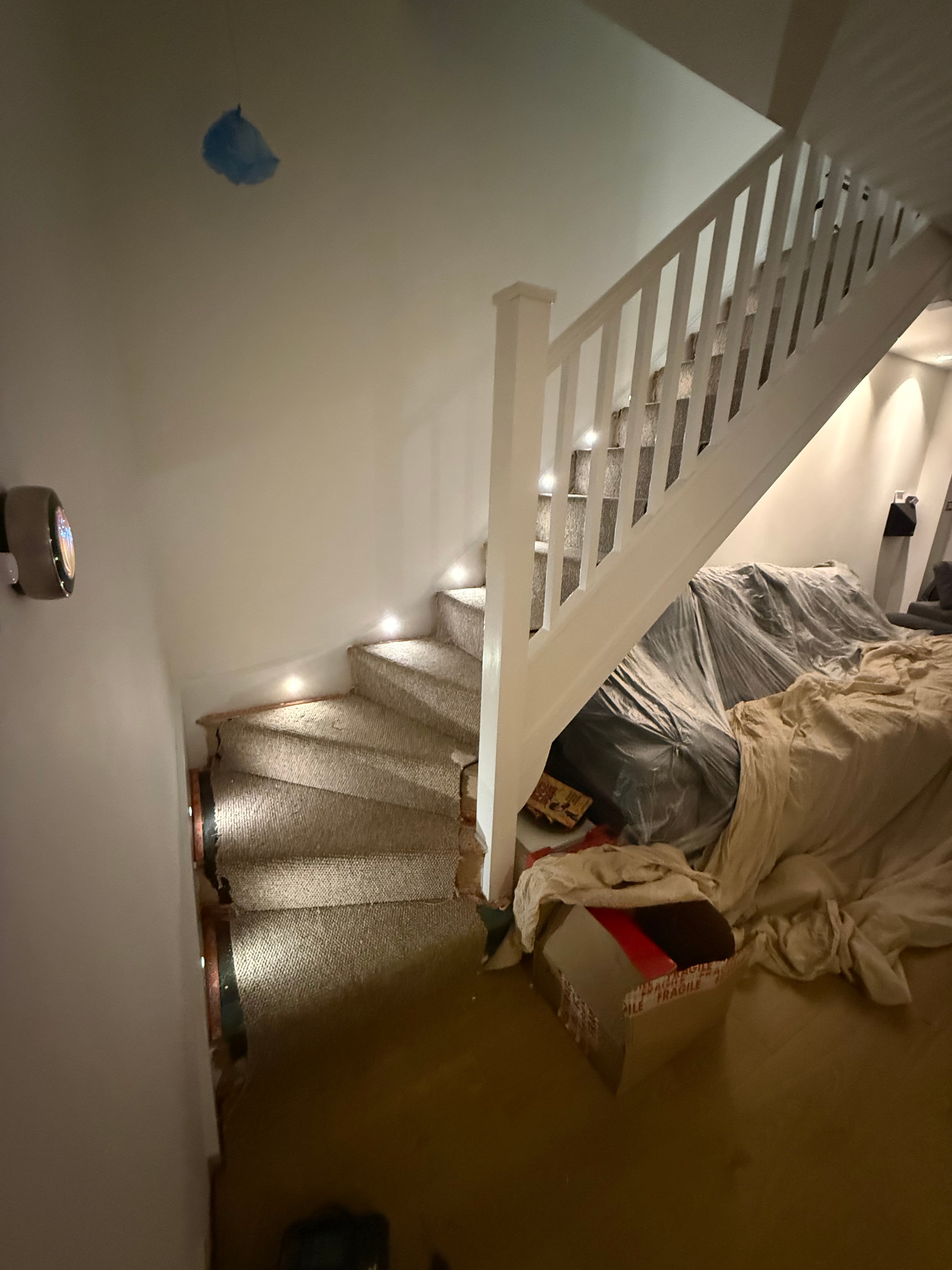 Stair riser lights installed with carpet underlay still on