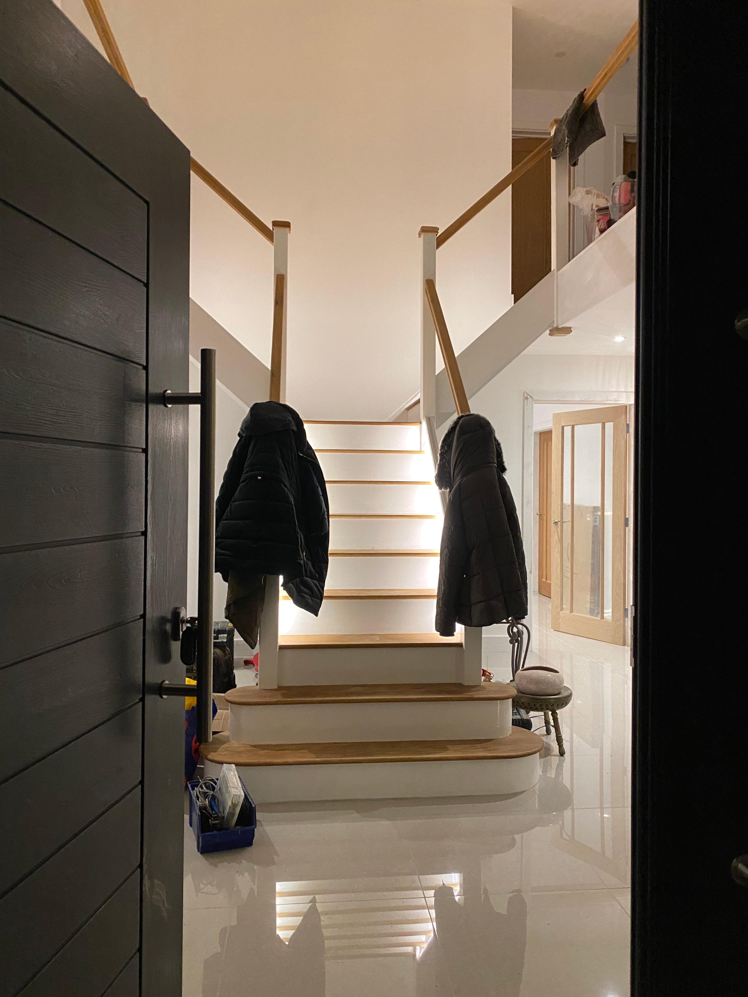 Staircase LED strip lighting with oak treads and landing